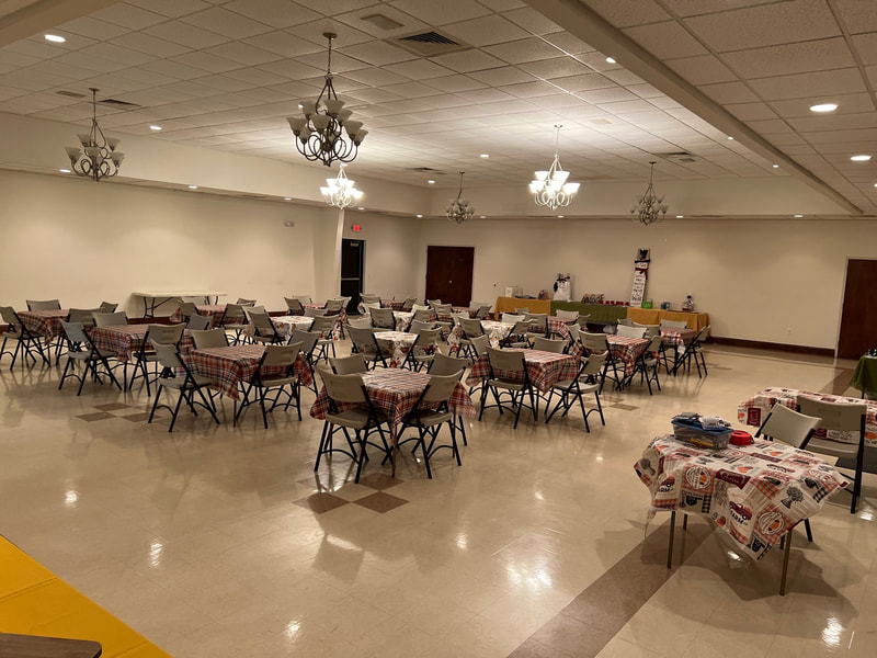 Interior of the Garner Civitan Center banquet room with tables and chairs arranged for an event