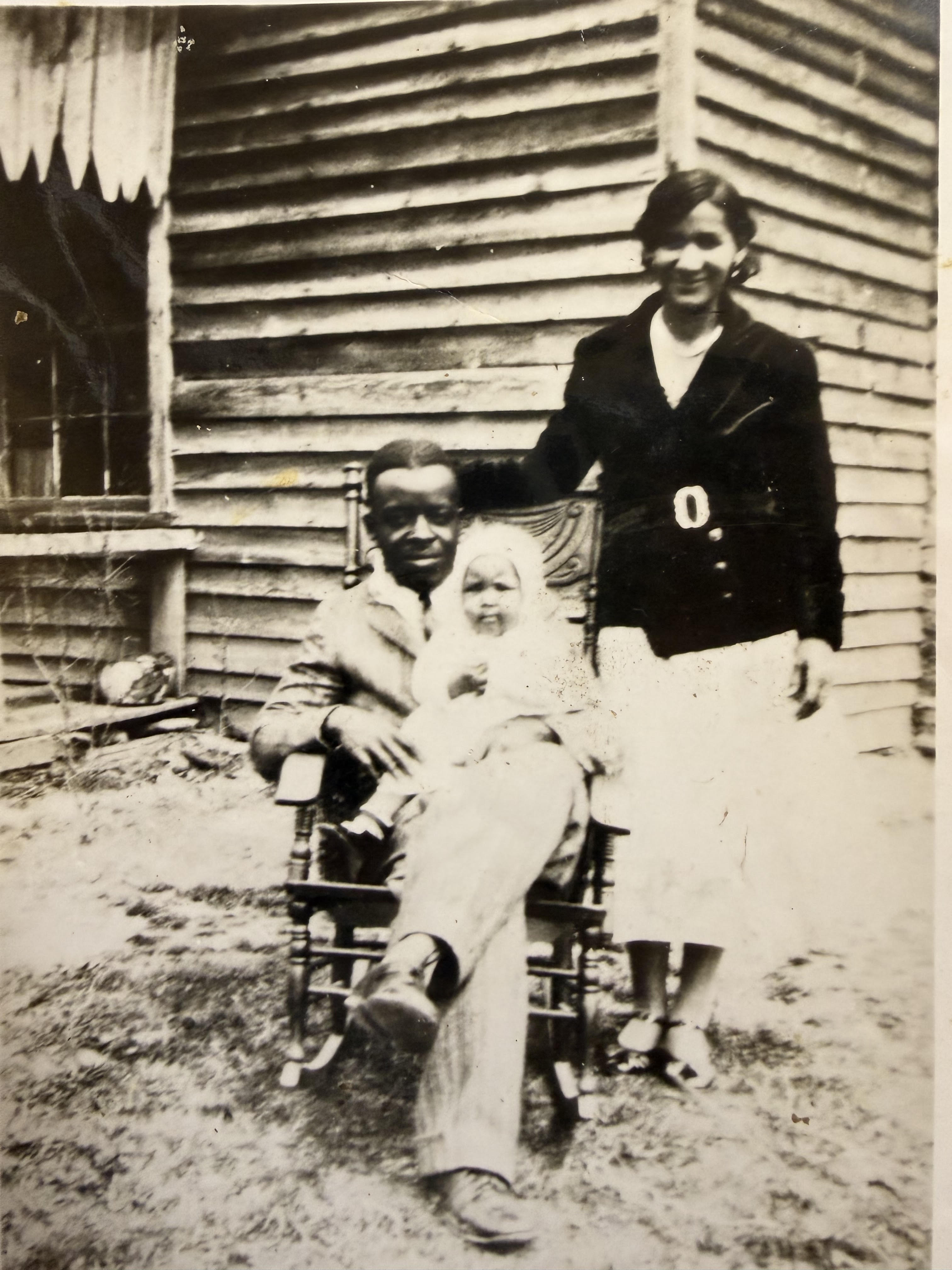 Historic Watson family photograph featuring a woman, man, and baby